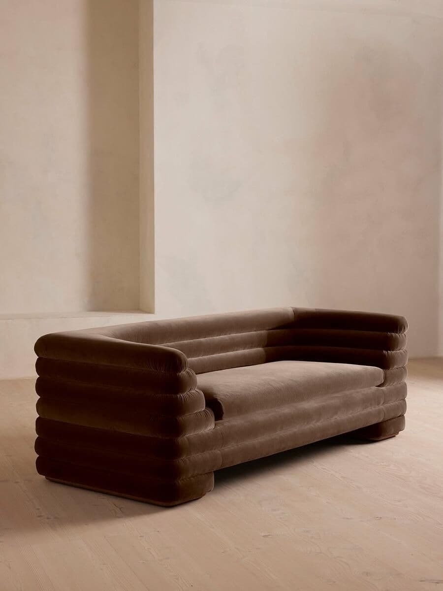 Home — sculptural brown sofa in a minimal interior